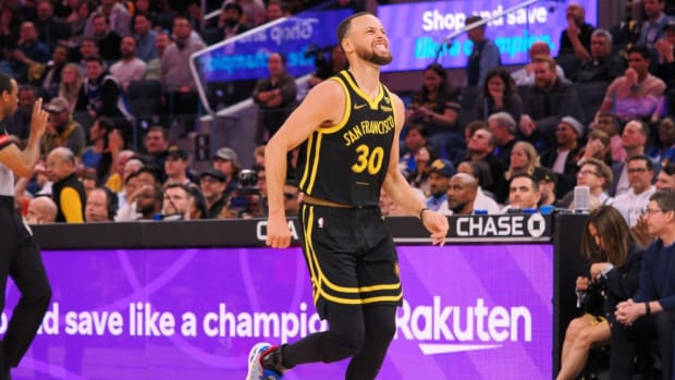 Golden State Warriors guard Stephen Curry limps around the court after a play against the Chicago Bulls during the fourth quarter at Chase Center.